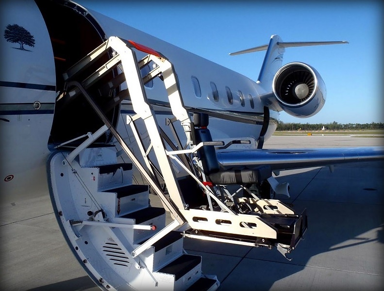 Challenger 604 with titanium hydraulic wheelchair lift deployed at the airstair